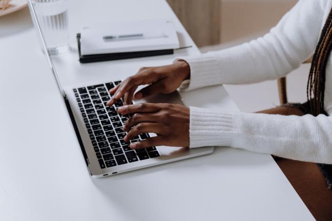 Woman Typing on a computer